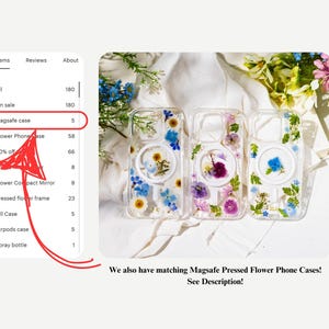 May include: Three clear phone cases with pressed flowers and a circular MagSafe feature. The cases are adorned with blue, purple, and white flowers. The text in the image says "Magsafe case" and "We also have matching Magsafe Pressed Flower Phone Cases! See Description!"
