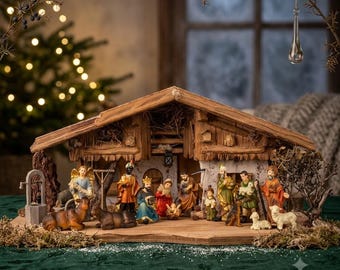 May include: A wooden nativity scene set featuring a stable structure with a thatched roof, housing hand-painted figurines of the holy family, three wise men, an angel, a shepherd, and various farm animals including a cow, donkey, and sheep.