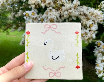 Swan and Bow Handmade ceramic Tile, bathroom tile, porcelain, cottagecore pottery, abstract ceramics, flower mugs, wall hanging decor