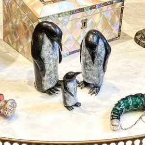 Everyone needs a waddle ! A charming family of three Solid Bronze Emperor Penguins with a beautiful patina and golden highlights, English