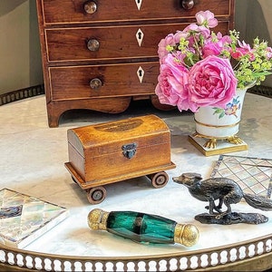 Life’s a train get on board!The Duke said giving the Duchess an Antique Mauchline Ware Train Luggage Box.Hope it stops at Cartier,she said