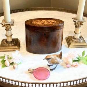 Tea Wickham?Darcy said holding an Antique George III Burr Yew Oval Tea Caddy,Yew are joking!He replied laughing holding a glass of Champagne