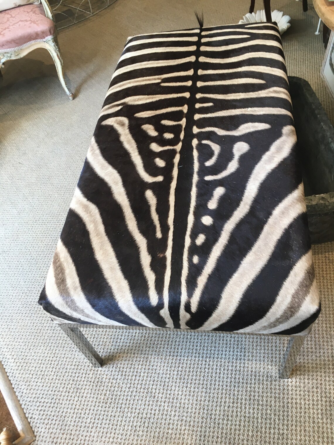 A very sleek and eclectic zebra hide bench / ottoman with a Etsy