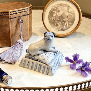 Love me love my Pug ,The Countess said holding an Vintage Ceramic Pug On A Cushion Figure by Francis ceramics, I love both,the Earl replied