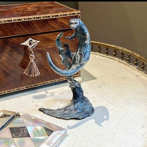 Come play with me !A lovely free flowing  limited  edition stylised solid bronze Otter sculpture with a lovely patina ,burnished highlights