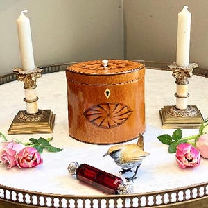 When the Priest gave Lady Catherine a George Ill Satinwood Navette Inlaid Tea Caddy she said,Crack open the champagne I have lots to confess