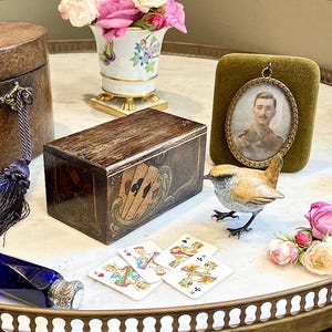 Sometimes you have to hugg someone to know how big to make the hole in your garden,Dorian Gray laughed  holding An Antique Italian Card Box