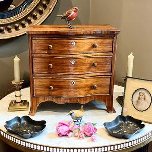 Mad Hatter what’s in your Antique Miniature Chest Of Drawers? Why my Cufflinks & Bow Ties of course.One must always look smart at Tea Alice