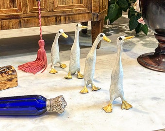 Join the Queue!A whimsical set of four Solid cold painted bronze Indian Runner Ducks hand made in the United Kingdom with a beautiful patina