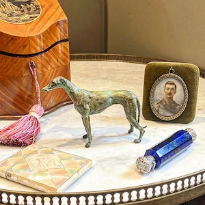 Wickam’s motto was”Love Me Love my dog”& knew he was out of the dog house when the Italian Heiress gave him the Greyhound Lurcher Bronze