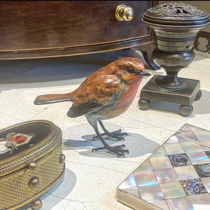 Robins appear when loved ones are near.An enchanting life size Solid Bronze Robin Sculpture with a lovely  patina hand made in the UK