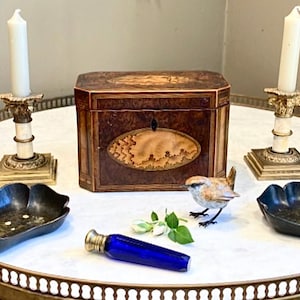 Tea Wickham?Darcy said holding an Antique George lll Burr Yew Wood Tea Caddy.Yew are joking!He replied laughing holding a glass of Champagne