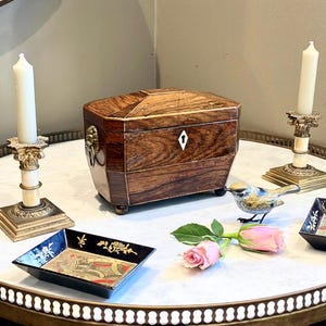 If you don’t have anything nice to say come sit by me Wickham,Lady Catherine said at tea holding an Antique Georgian Rosewood Tea Caddy,