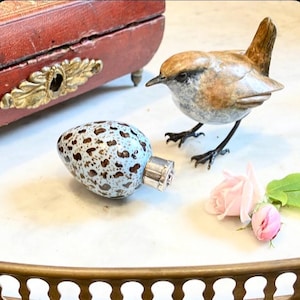 How do you like your eggs in the morning?Wickham said giving the Countess an Antique Egg Scent Bottle,With champagne of course,she replied