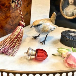 Wickham had Joie de Vivre when the Countess gave him Antique Ruby Glass Acorn Scent Bottle,all one needs is an Heiress & a new cologne