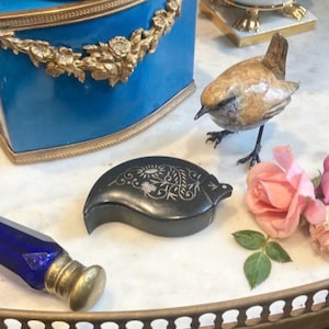 May include: A set of three ceramic mugs with a speckled, matte finish. The mugs are in shades of cream, light gray, and dark gray. Each mug has a simple, minimalist design, perfect for coffee or tea.