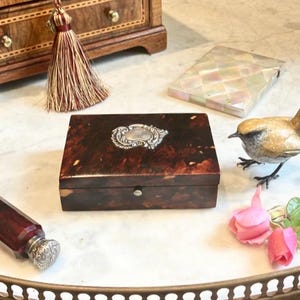 Countess shall I put the Antique Faux Tortoiseshell Jewellery Box With Silver Cartouche in your Bentley? I’m in the Skoda Today, she replied