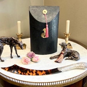 Dorian Gray used his Grand Sterling Silver & Faux Tortoiseshell Page Turner reading Oscar Wilds new book but thought the ending was rubbish