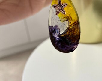 Resin pendant with daisy, Gorgeous yellow and purple combination with glitz of blue sparkle, lightweight, Gift for her...