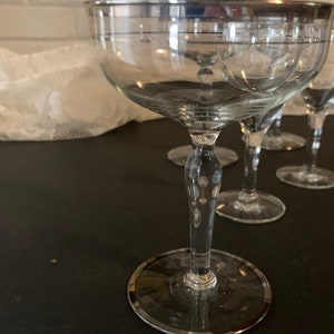 Three vintage champagne/wine and two matching cordial glasses trimmed in silver