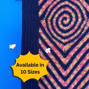 May include: A navy blue and multi-colored crochet scarf hanging on a wooden hanger. The scarf features a spiral and chevron pattern in pink and yellow. The text "Available in 10 Sizes" is displayed on a yellow burst.