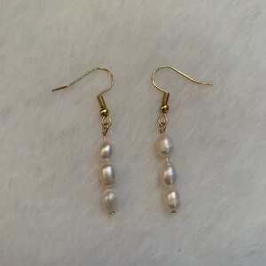 Pearl and gold dangle earrings