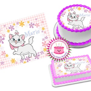 May include: A white cake with pink frosting and a pink and white edible image of Marie from Disney's The Aristocats. The image features Marie with a pink bow and surrounded by pink and yellow flowers. The cake is decorated with the name "Marie" in blue lettering.