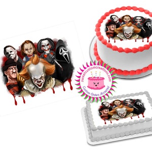 May include: A white cake with a red border and a printed image of horror movie characters, including Pennywise the clown, Freddy Krueger, Jason Voorhees, Michael Myers, and Ghostface. The cake is decorated with red icing drips.