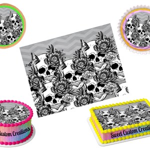 May include: A set of edible cake toppers featuring a black and white skull and floral design. The toppers are available in various sizes, including a round cake topper, a square cake topper, and cupcake toppers. The toppers are perfect for a Halloween party or a Day of the Dead celebration.