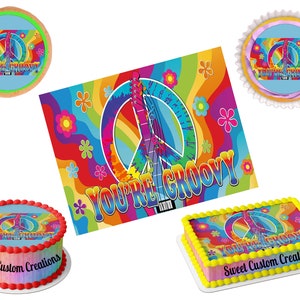 May include: A set of edible cake toppers featuring a peace sign, guitar, and rainbow colors with the text "You're Groovy". The toppers are available in different sizes and shapes, including round, square, and rectangular. The toppers are perfect for a 1960s or 70s themed party.