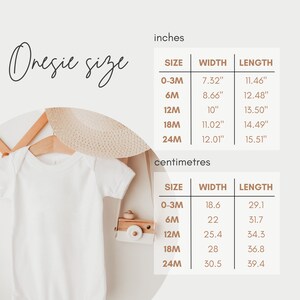 May include: A white onesie on a hanger with a straw hat and a wooden toy camera. The onesie size chart is shown in inches and centimeters.