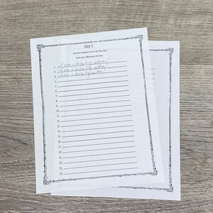 May include: A black and white printable worksheet with the text "Day 1:  I am a bestselling author!" and numbered lines for writing affirmations.