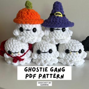 May include: A group of handmade crochet ghost figures in white, each with black button eyes and a stitched mouth. Some ghosts wear hats, including an orange pumpkin hat and a purple witch hat. The text "Ghostie Gang PDF Pattern" is displayed.