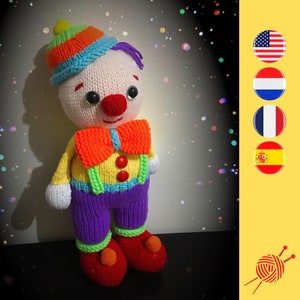 May include: A knitted clown doll with a colorful hat, orange bow tie, and yellow and purple clothing. The doll has a red nose and black eyes.