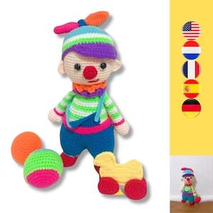 May include: A crocheted clown doll with a colorful striped shirt, blue overalls, and a purple hat. The doll is holding a yellow toy duck with red wheels and is playing with two multi-colored balls.