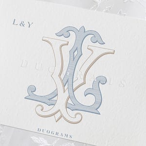 May include: A white rectangular card featuring a blue and beige intertwined monogram logo. The text L&Y appears in the top left corner, and the word DUOGRAMS is printed in dark blue at the bottom centre. The card has a textured paper finish.