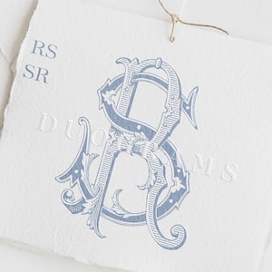 May include: A blue and white monogram with the letters "RS" intertwined. The monogram is surrounded by ornate flourishes and is set against a white background. The text "DUOGRAMS" is visible at the bottom of the image.