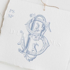 May include: A blue and white monogram with the letters "PS" intertwined. The monogram is on a white background with the text "DUOGRAMS" below it.