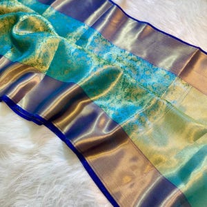 Wedding-ready tissue silk Banarasi sari in sea green and gold with rich traditional craft