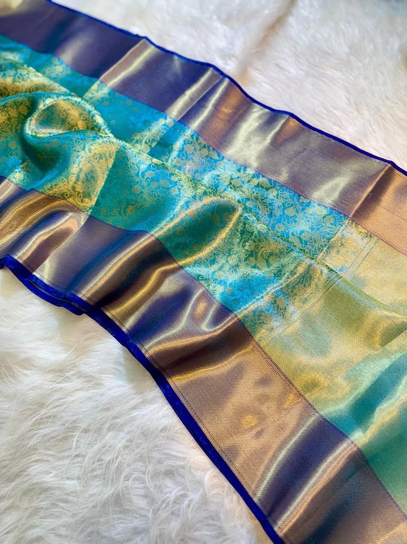 Wedding-ready tissue silk Banarasi sari in sea green and gold with rich traditional craft