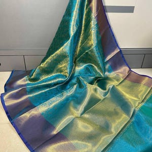 Celebrity-inspired soft tissue silk Banarasi saree in sea green and gold from NISA FABRICS