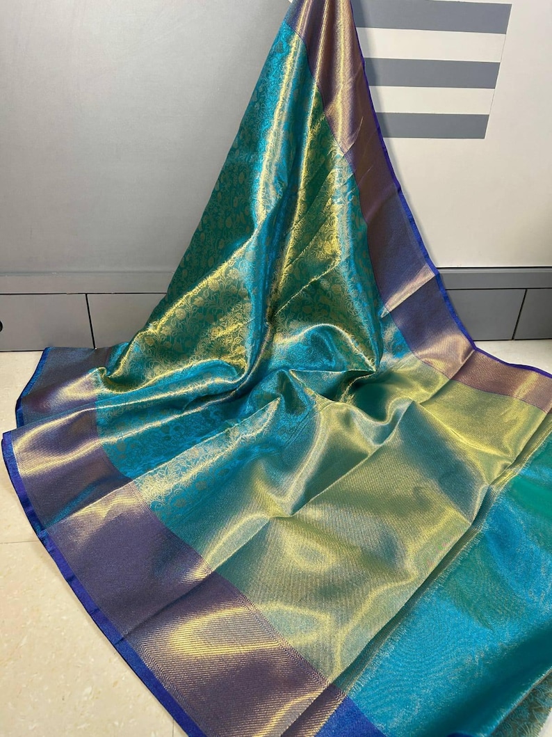 Celebrity-inspired soft tissue silk Banarasi saree in sea green and gold from NISA FABRICS