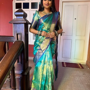 Bridal saree in sea green Banarasi silk with lustrous golden border – premium woven fabric