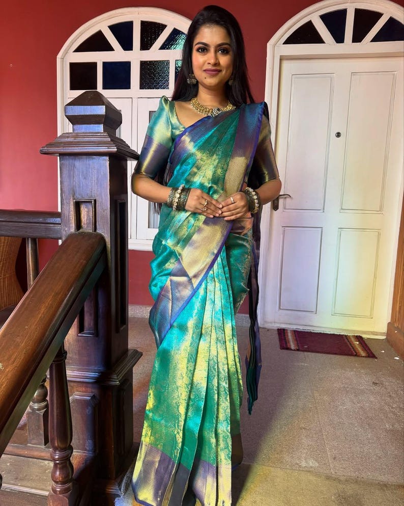 Bridal saree in sea green Banarasi silk with lustrous golden border – premium woven fabric