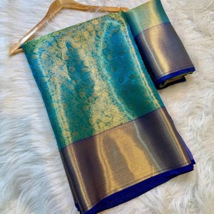 Glamorous Banarasi soft silk saree with golden zari border in a modern celebrity-inspired look