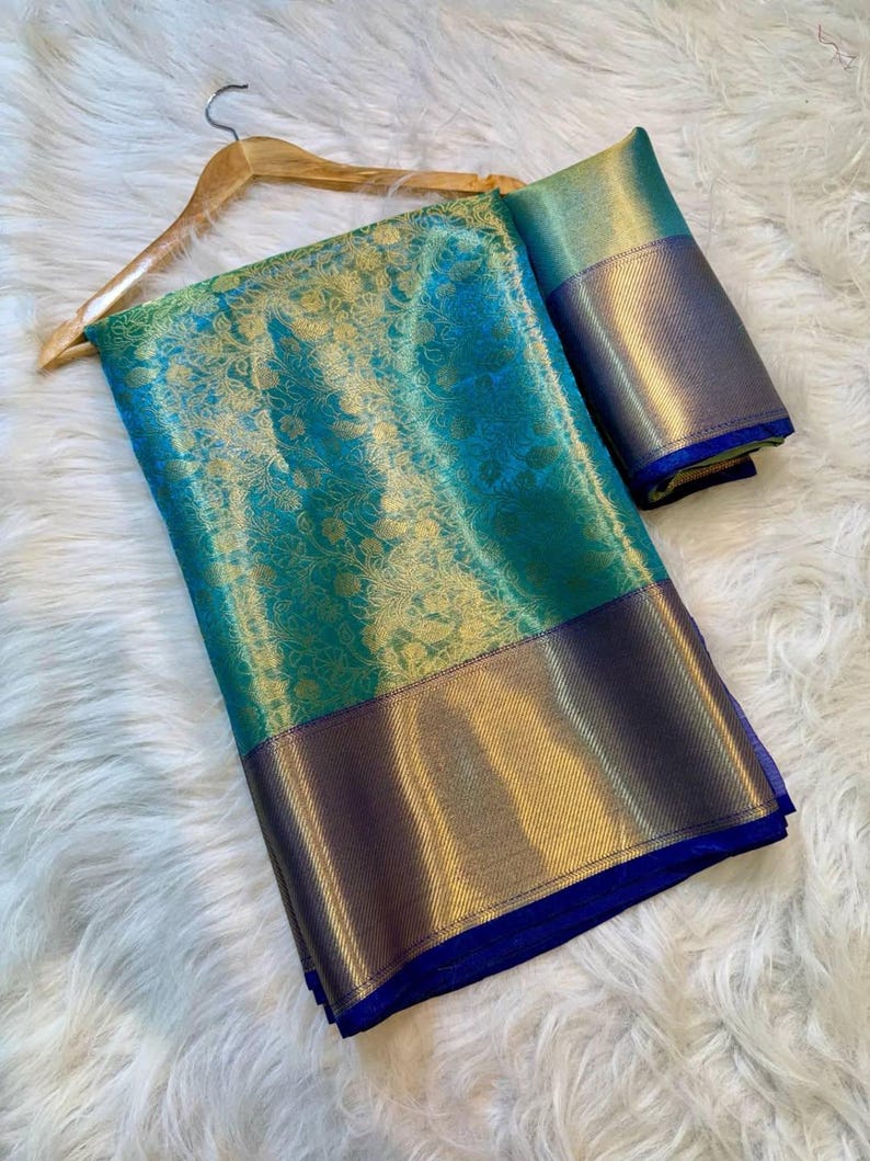 Glamorous Banarasi soft silk saree with golden zari border in a modern celebrity-inspired look
