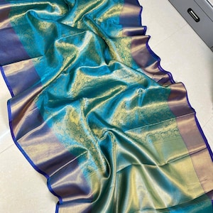 Traditional yet trendy Banarasi saree with antique gold zari border and floral weaving