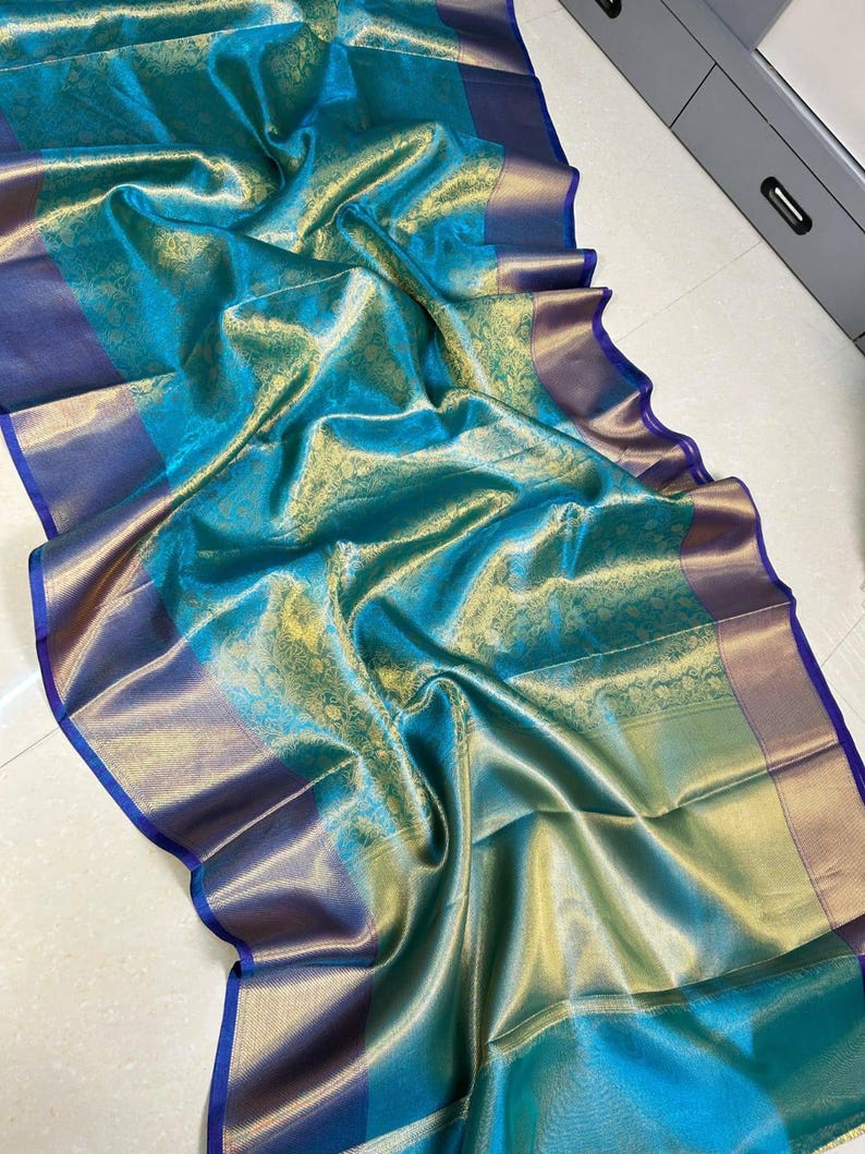 Traditional yet trendy Banarasi saree with antique gold zari border and floral weaving