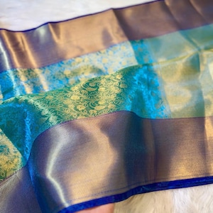 Sea green and gold Banarasi saree with antique motifs – perfect for festive occasions
