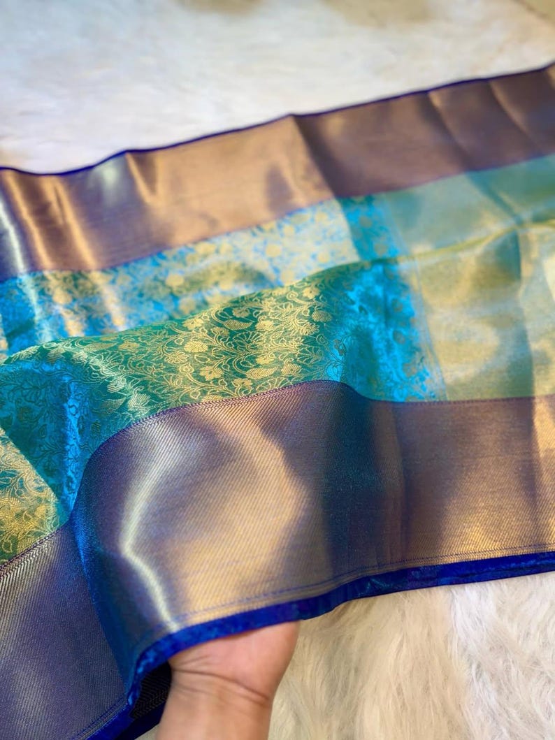 Sea green and gold Banarasi saree with antique motifs – perfect for festive occasions